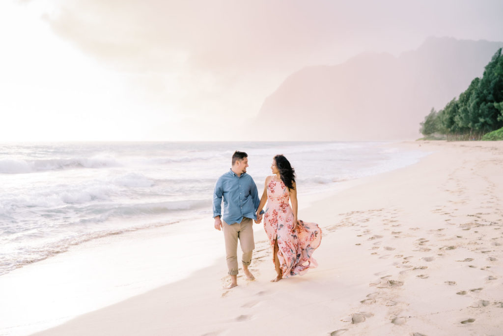 Waimanalo bay beach on the island of  Oahu at sunrise for a local couples engagement session. Professional photographer for couples in Hawaii captured this moment. 