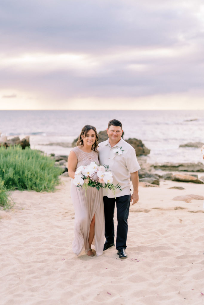 Oahu small wedding photographer Megan Moura captured photos of a newlywed couple.
