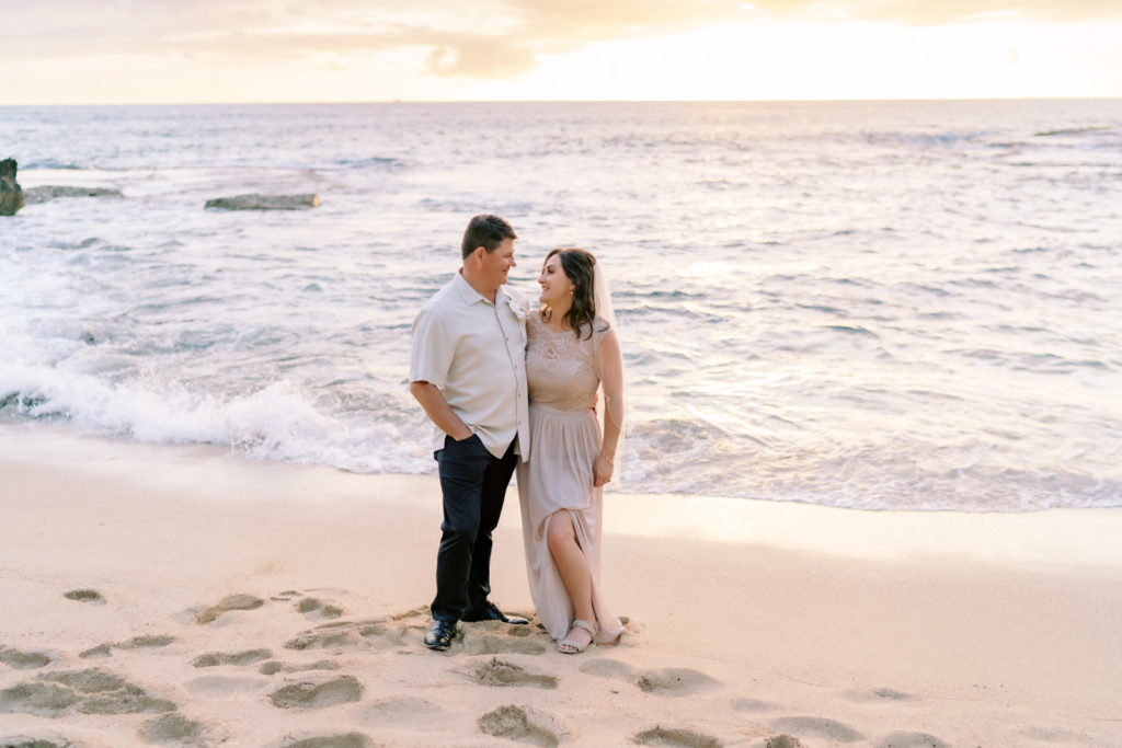 Photos of the bride and groom at the Oahu Four Seasons Resort.