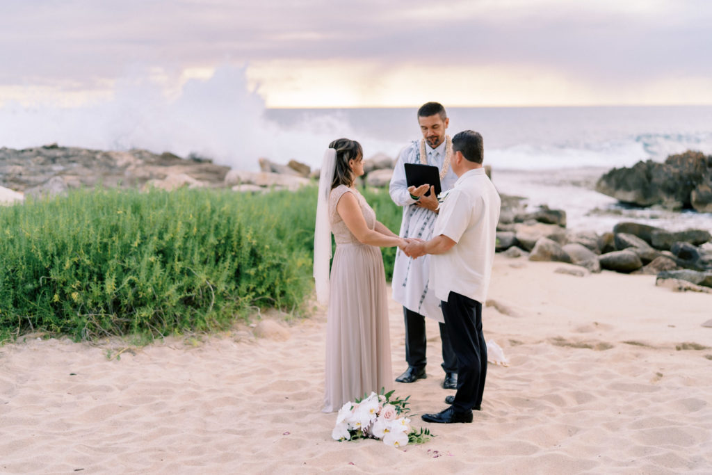 A newlywed couple at the Four Seasons Resort on Oahu. Wedding photographer Megan Moura captured the moment.