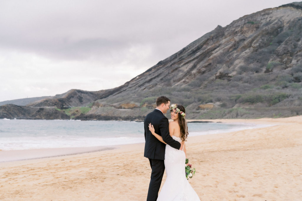 Honolulu wedding photographers often choose the quiet solitude of Sandy Beach on Oahu to take pictures of newlyweds