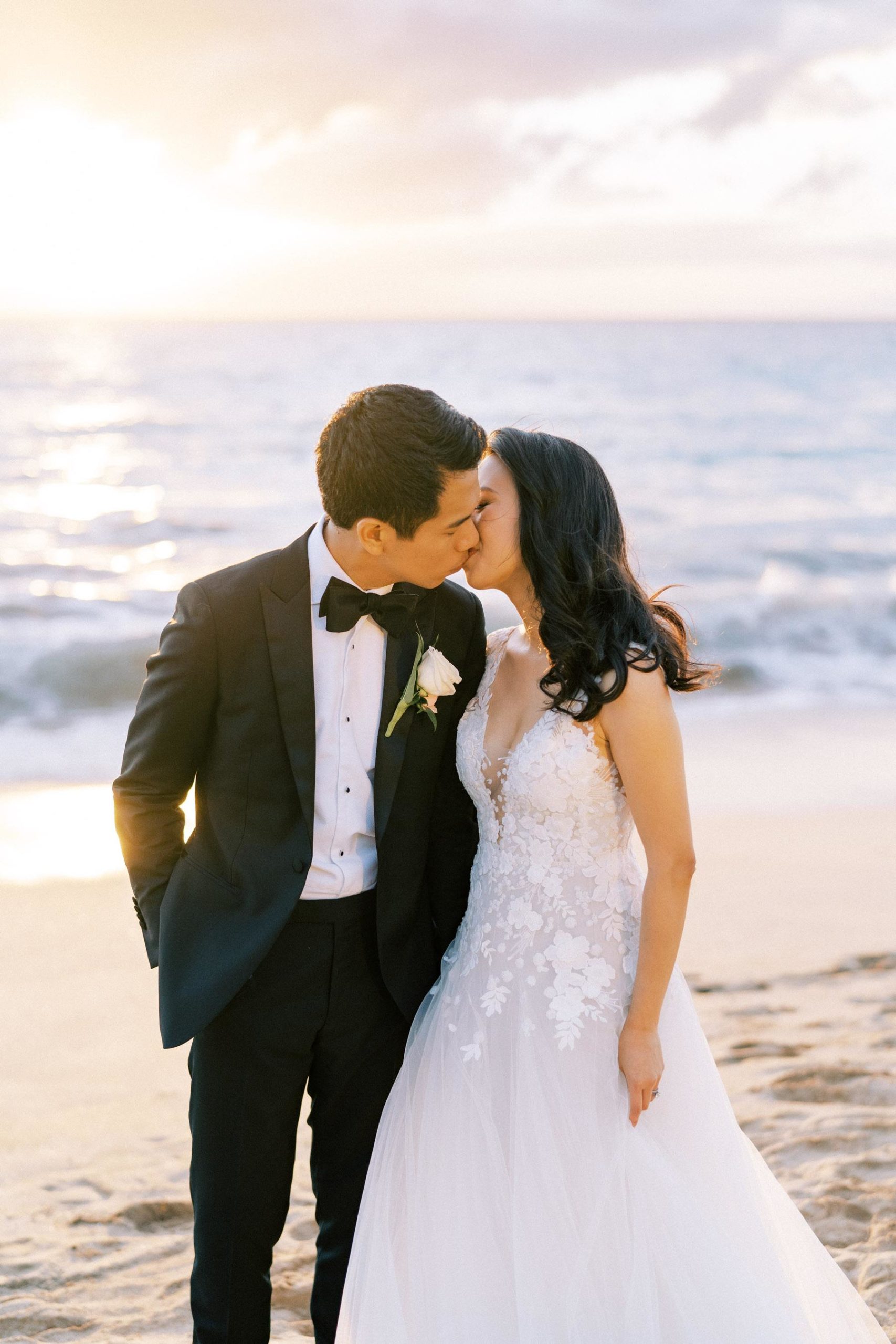 Newlyweds kissing at the beach Wedding in Hotel Wailea