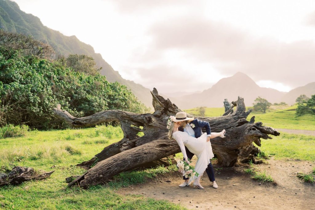 Intimate shot of Newlyweds kissing at Kualoa Ranch Elopement Photographer