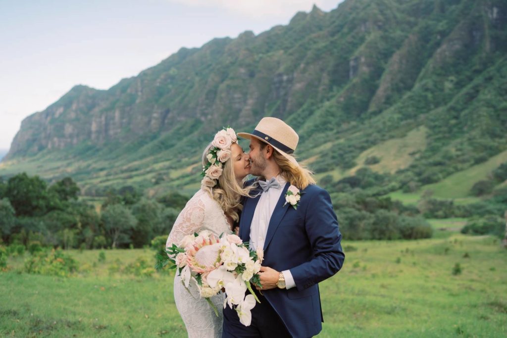 Kualoa Ranch Elopement Photographer newlyweds first kiss