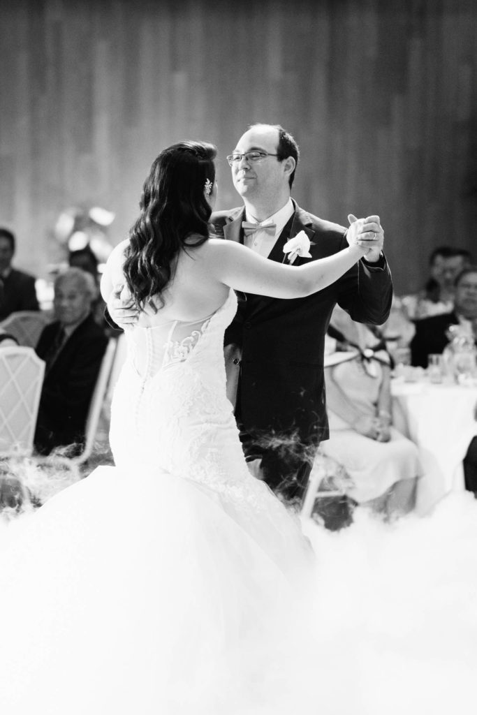 black and white photo of the Newlyweds first dance at Oahu Wedding in the Halekulani Hotel