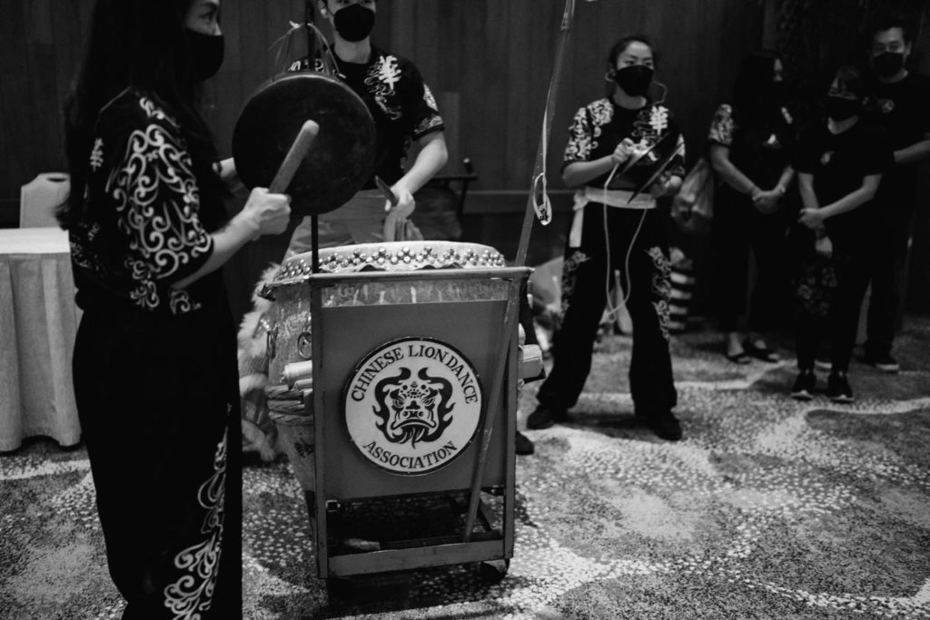 Black and white photo of the chinese lion dance band for Oahu Wedding at The Halekulani Hotel