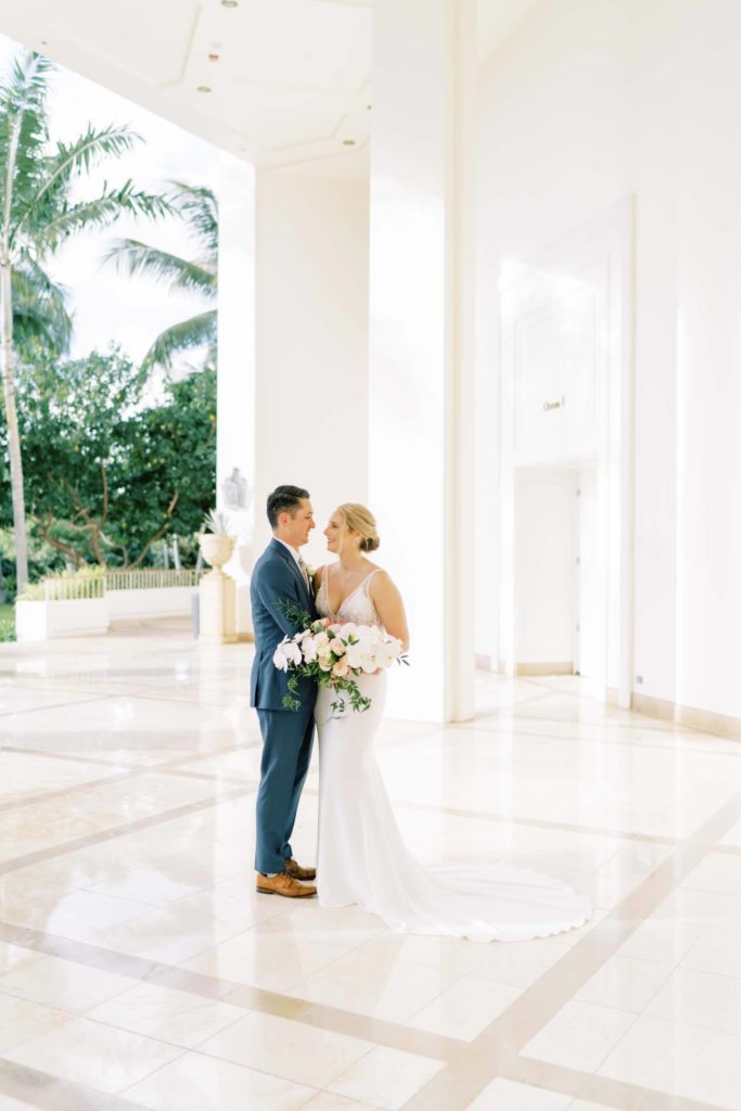 Bride and Groom hugging each other in the Four Seasons Resort Intimate Elopement on Oahu Hawaii