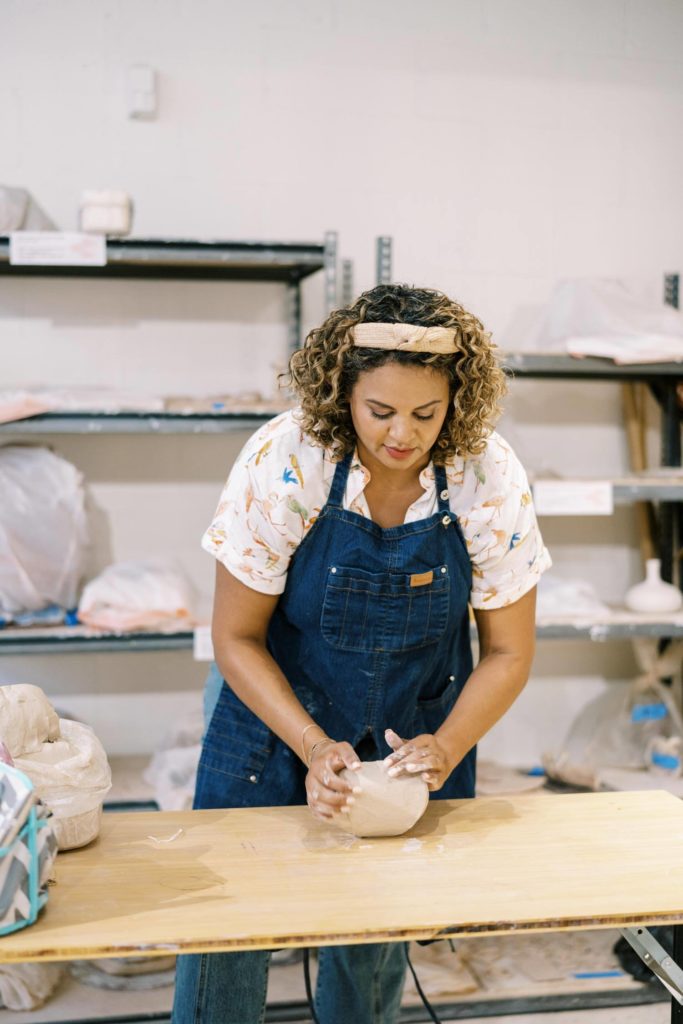 woman doing pottery personal branding session
