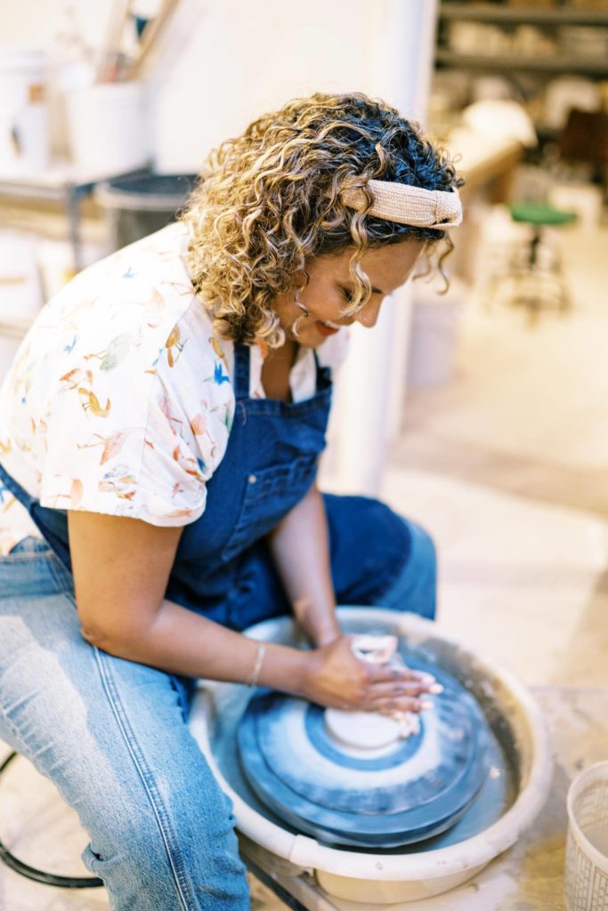woman smiling while doing pottery personal branding session 