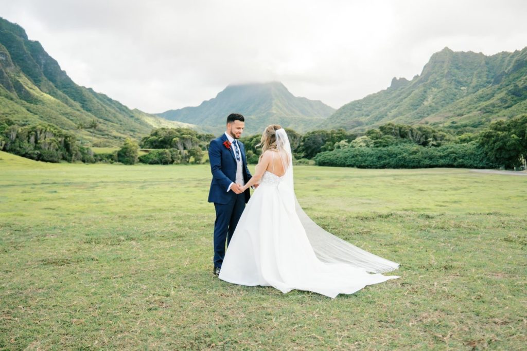 Groom looking at his bride Intimate Elopement at Kualoa Ranch on Oahu