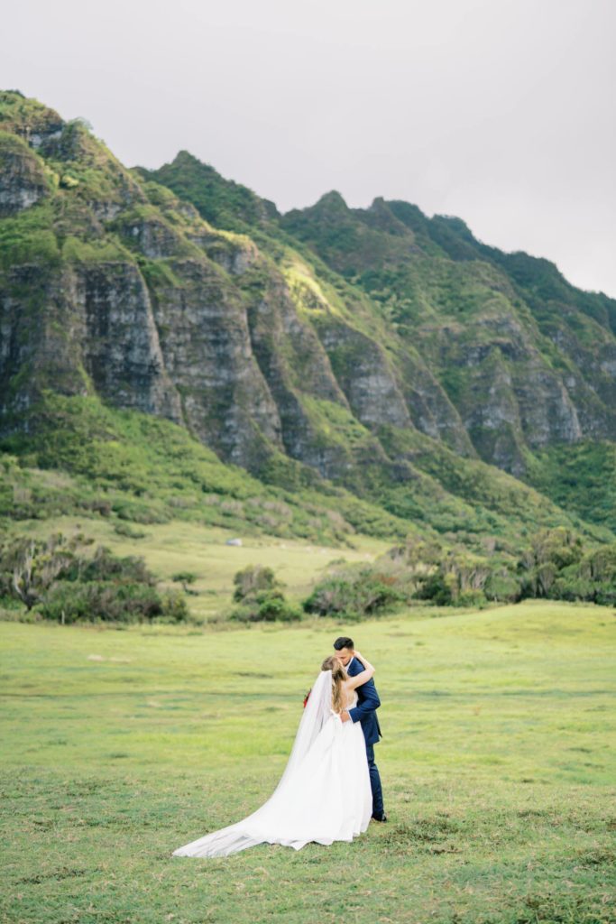 Kissing at Intimate Elopement at Kualoa Ranch on Oahu