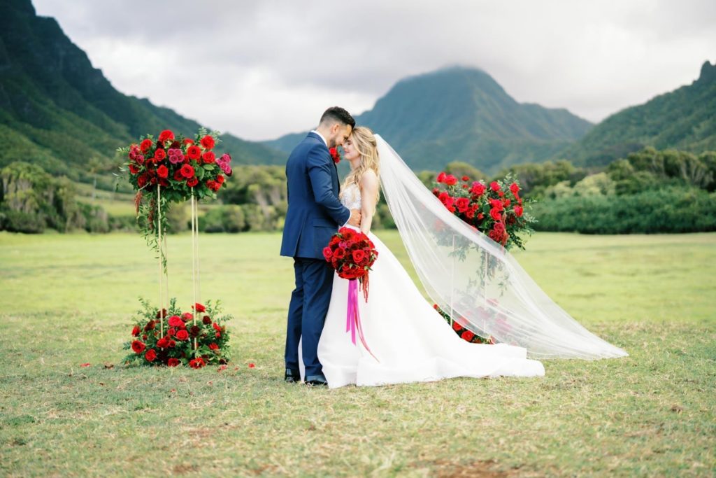 Bride and Groom looking at each others eyes at Kualoa Ranch