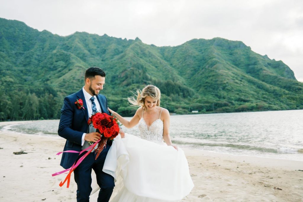 Newlyweds at Kualoa Ranch oceanside