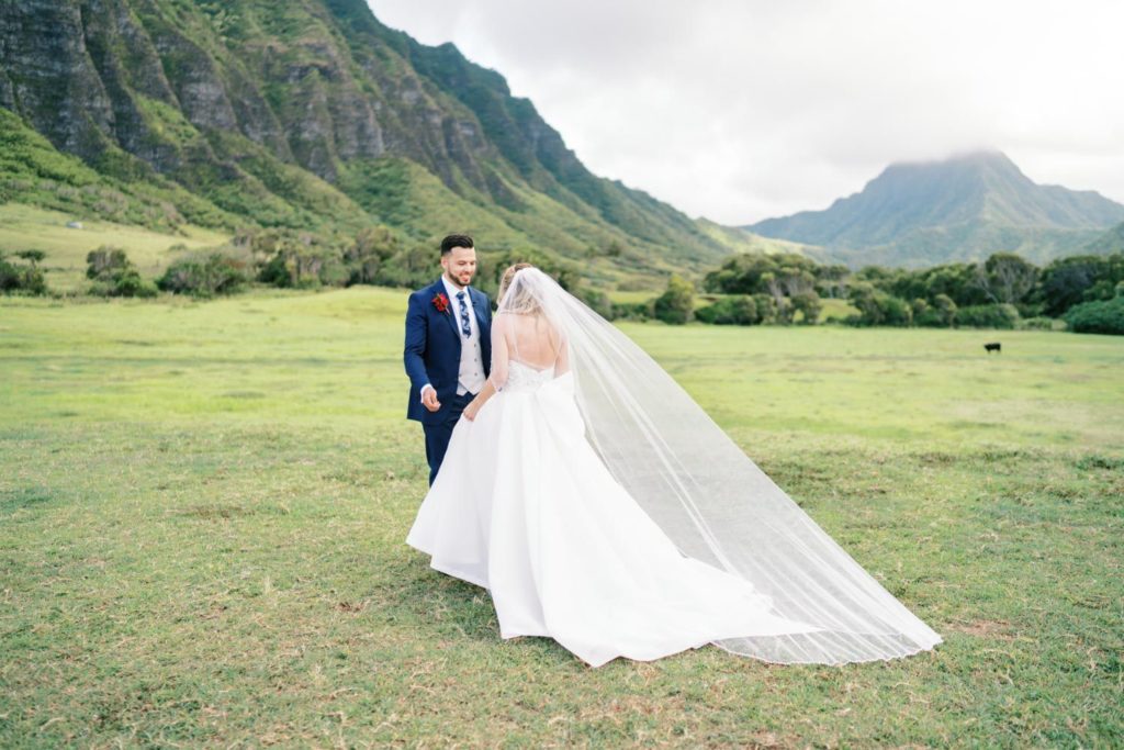 Bride and Groom standing at Kualoa Ranch