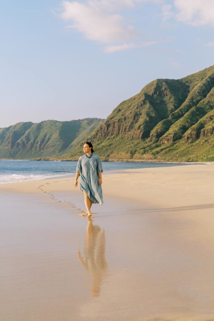 Woman walking on the shore of Waianae Beach in Oahu Personal Branding Session Hawaiian Culture