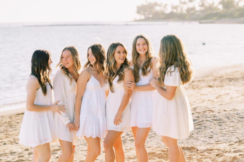 Group of beautiful young ladies in white dress at the beach - Oahu High School Senior Portraits