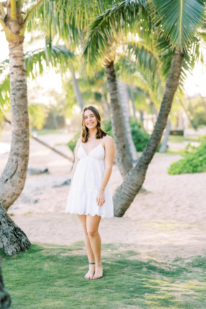 Pose under palm trees by the beach - Oahu High School Senior Portraits