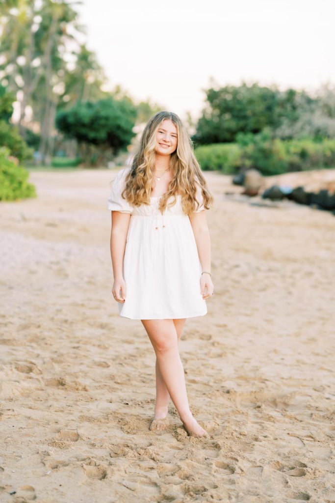 Young lady in white dress at the beach - Oahu High School Senior Portraits