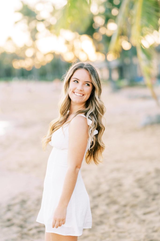 Young woman in white dress by the beach - Oahu High School Senior Portraits