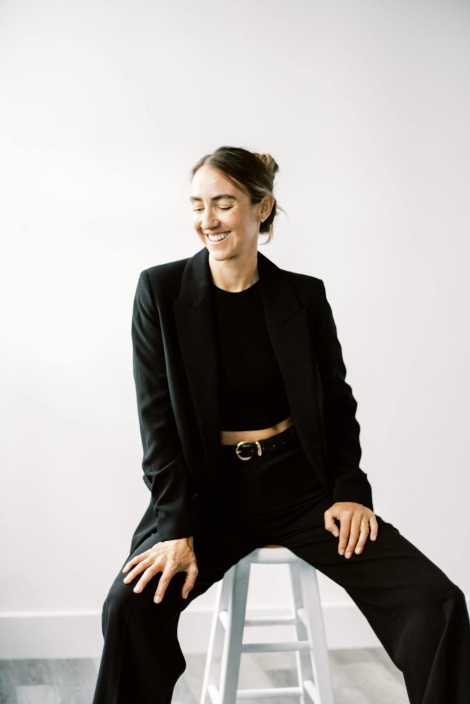 Woman smiling in black suit - Branding photography session