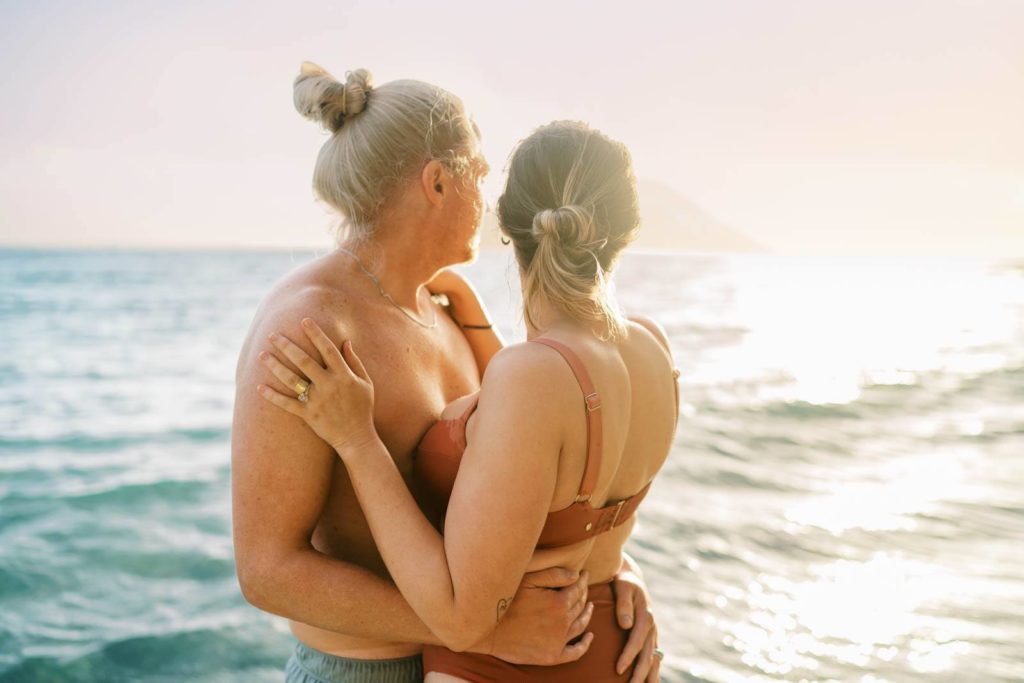 Couple at the beach during sunrise on Oahu