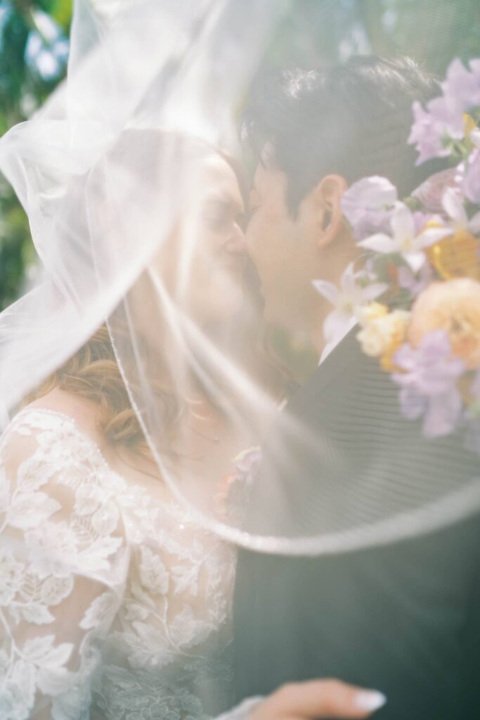 Newlyweds Intimate Kiss under the veil Private Home Wedding