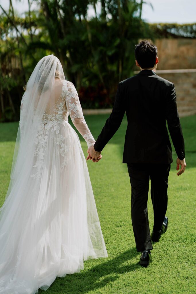 Private Home Wedding Newlyweds holding hands walking