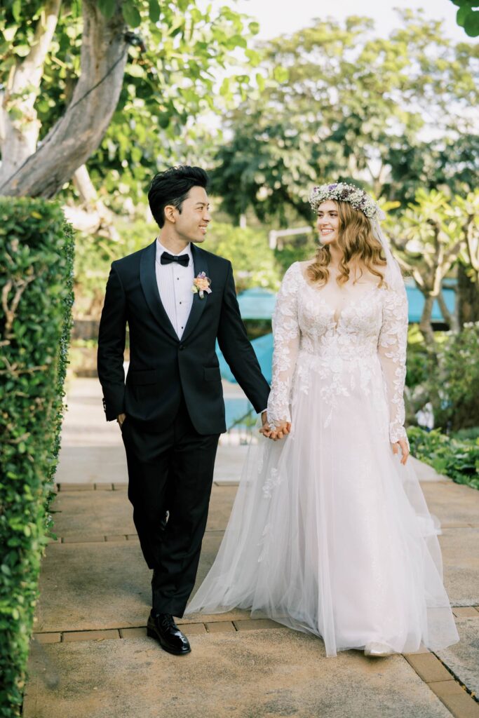 Newlyweds walking and looking into each other in their private home