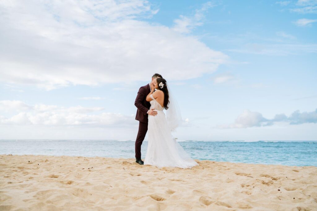 Oahu Private Wedding Day Newlyweds Kissing by the Beach