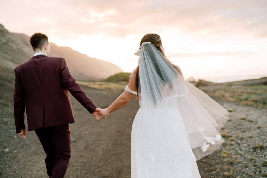 Oahu Private Wedding couple holding hands while walking