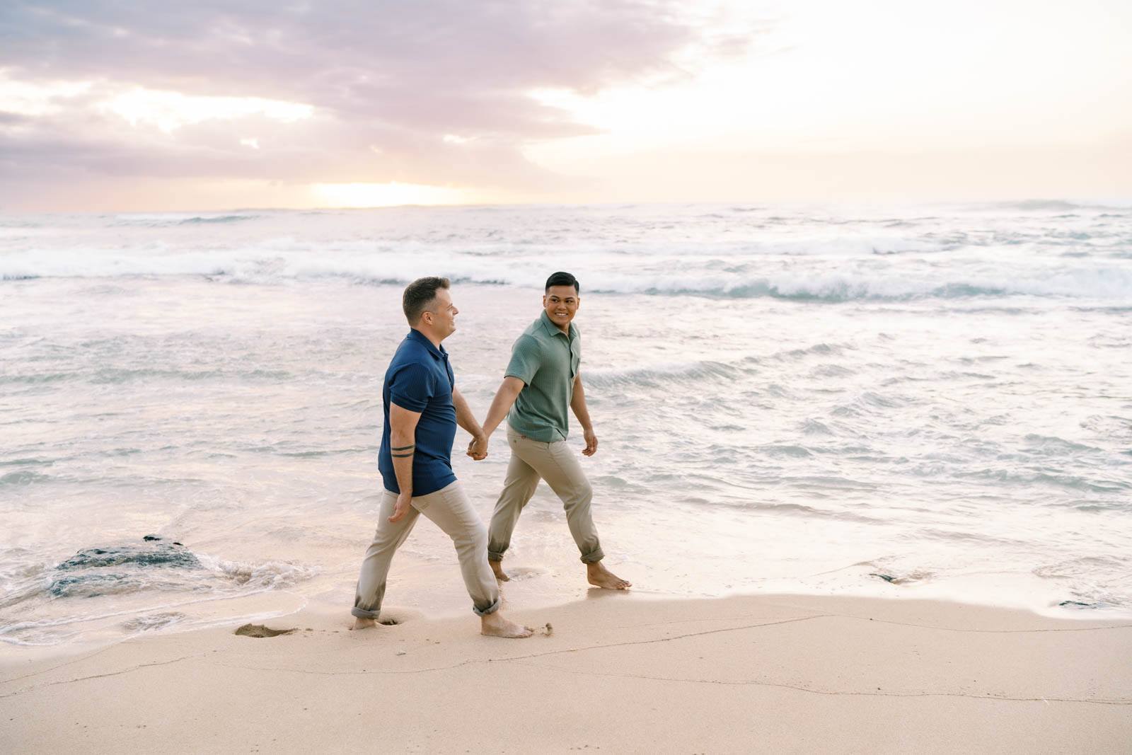 Oahu Engagement Session LGBTQ couple holding hands on the Haleiwa Beach 