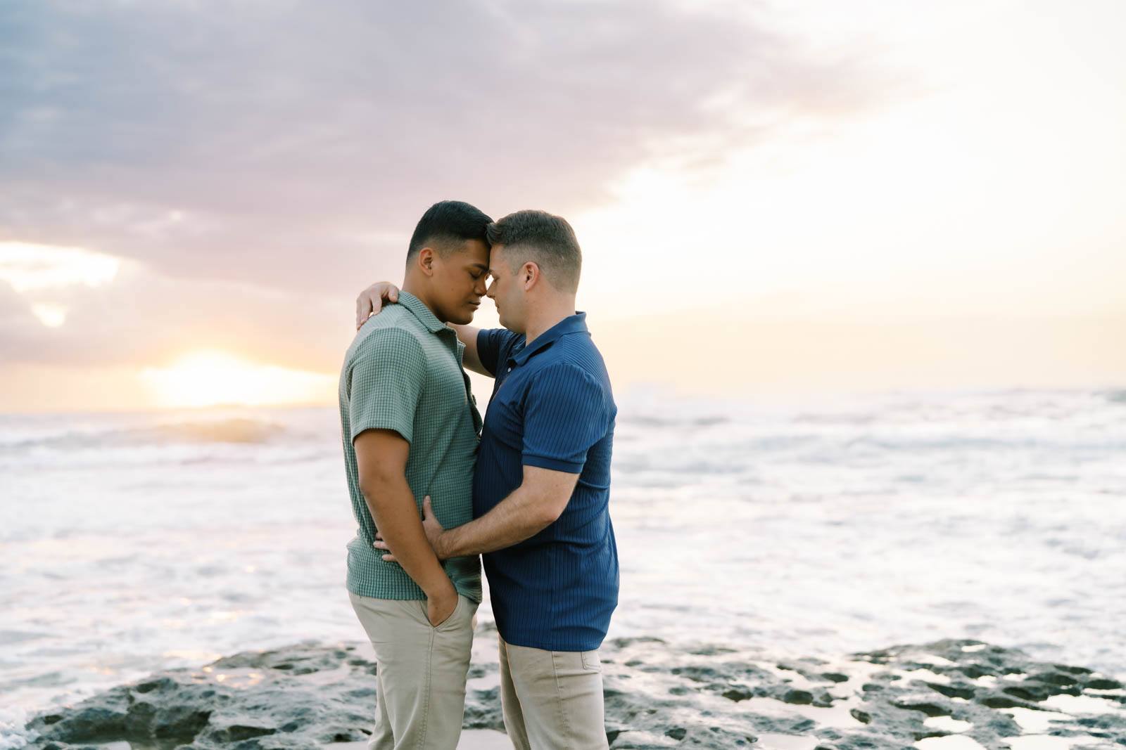 Oahu Engagement Session LGBTQ couple intimate hug on the Haleiwa Beach