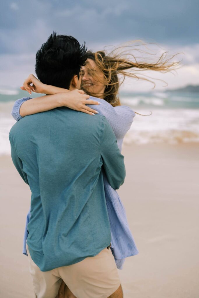 Engagement Photo Session Intimate hug by the beach