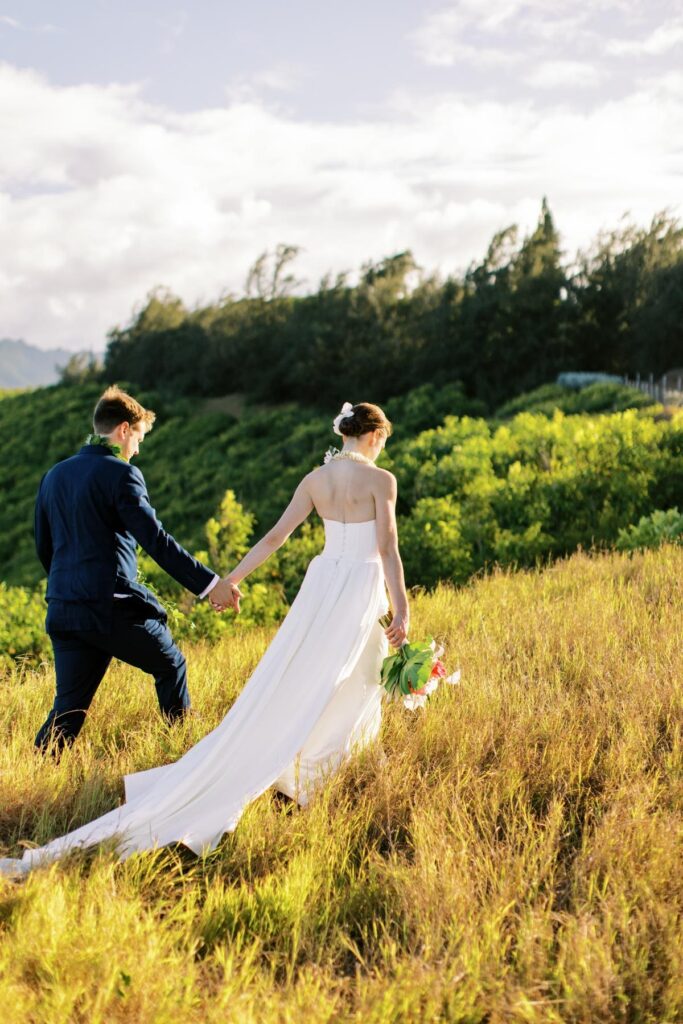Newlyweds walking on top of the hill Wedding on Kauai