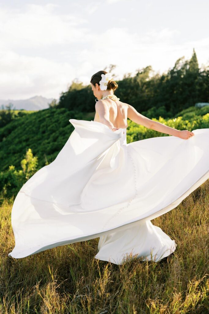 Bride walking on top of the hill on Kauai