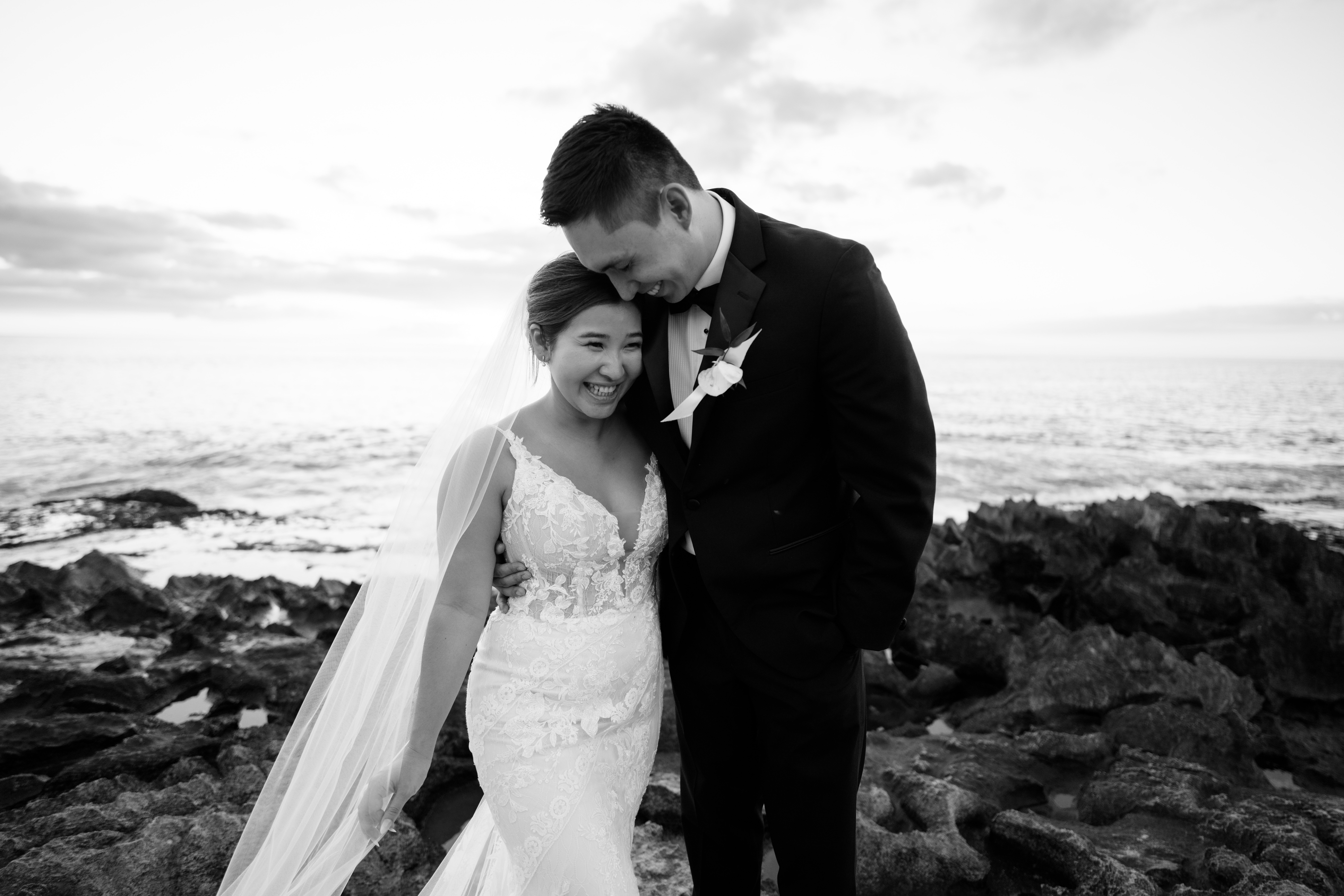 A black and white photo of a newlywed at the Four Seasons Oahu captured by Megan Moura Hawaii Wedding Photographer